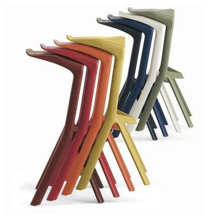Miura-bakruk_combi-kleuren Stacked colorful barstools ideal for a trade show booth or event venue.